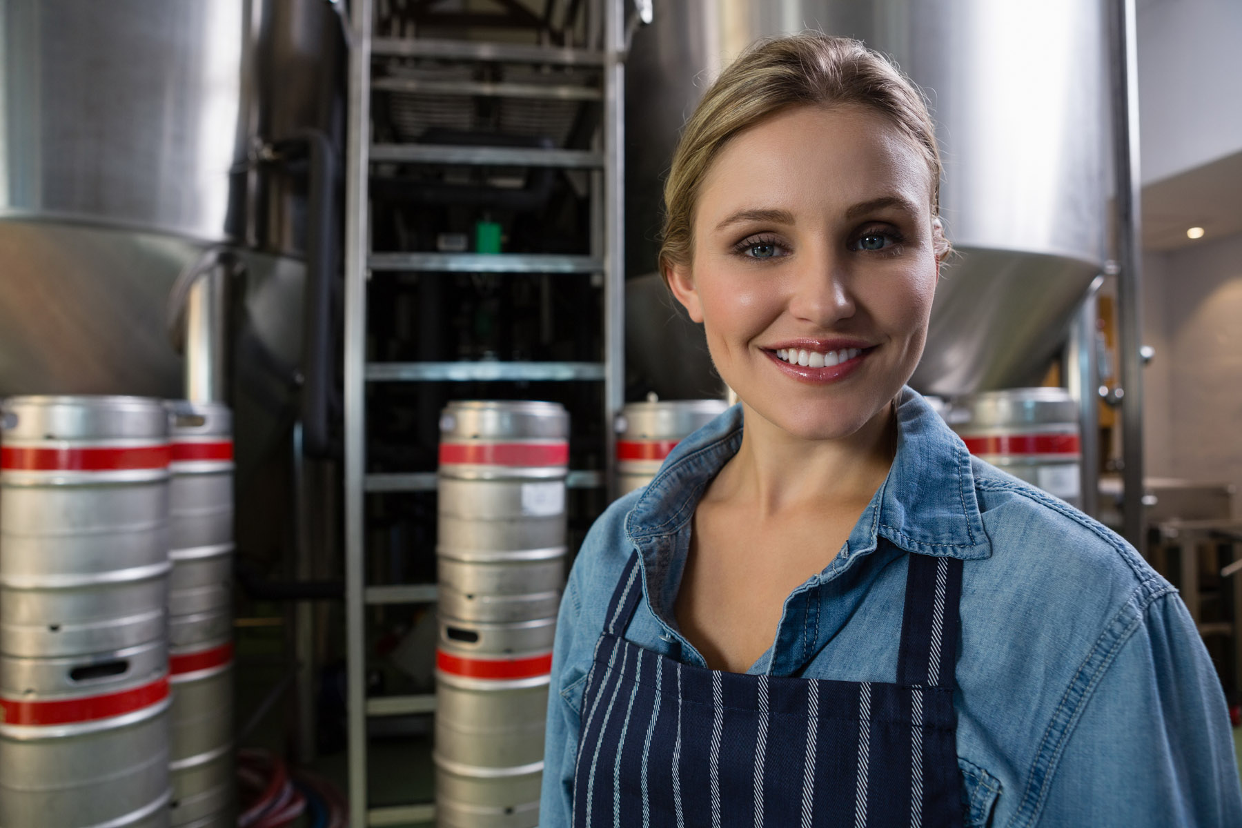 smiling worker in brewery