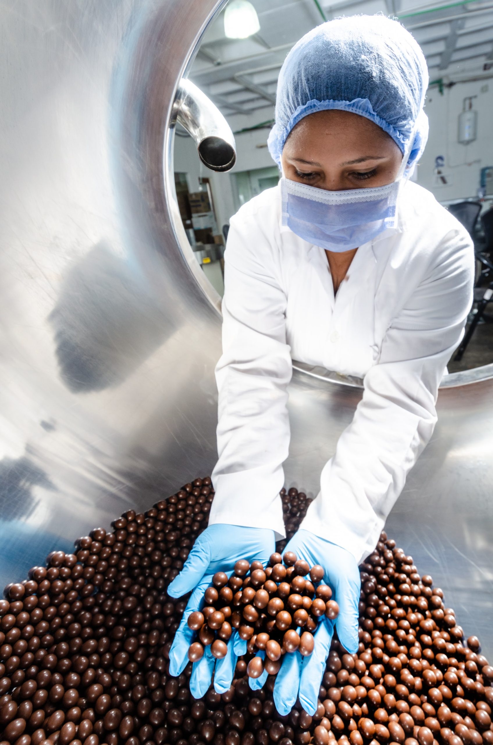 worker holding chocolates